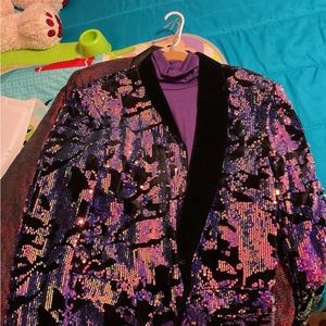 Never worn men prom jacket

Abstract Multicolor Sequin Tuxedo Jacket - 36R